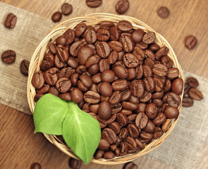 roasted coffee beans in wicker basket, close-up