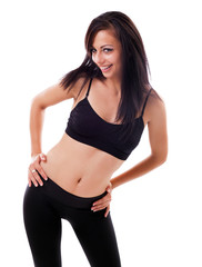 Fototapeta premium Sporty latin woman standing with hands on hips