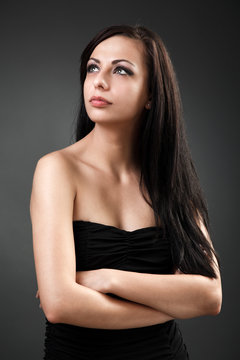 Beautiful hispanic woman standing with crossed arms