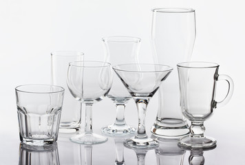 Group of various glasses on white background