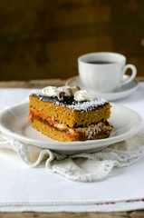Sponge-cake with apricot jam in chocolate