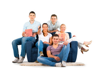 Young people sitting on a sofa smiling, on white background
