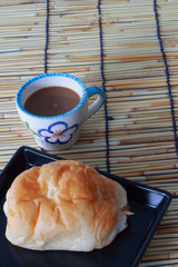Black bread with sausage, hot coffee