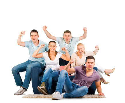 Young people sitting on a sofa and cheering, on white background
