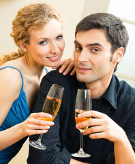 Cheerful couple with champagne