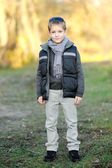 portrait of little boy outdoors in autumn