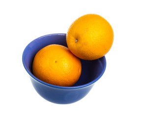 Heap of oranges in the dish