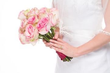 Young bride holding a bouquet on white background.