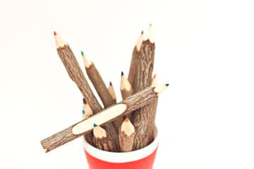 many color pencil in red cup