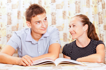 Obraz premium Two happy people learning together in the classroom