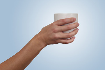 Woman's hand holding a cup
