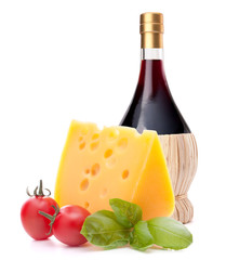 Red wine bottle, cheese and tomato still life