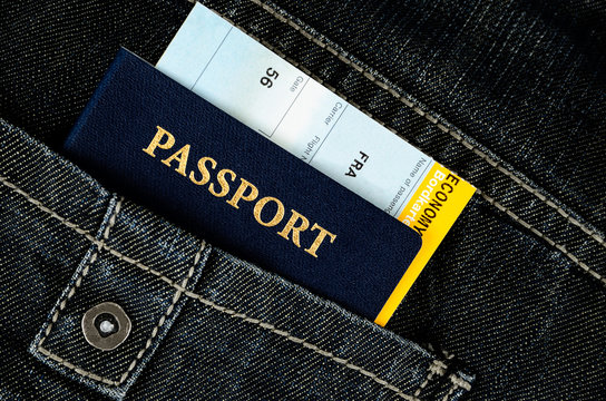 pasport with boarding pass in jeans