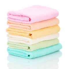 colorful towels isolated on white © Africa Studio