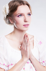 Fototapeta premium Devotion. Faith. Young christian woman praying against her sin