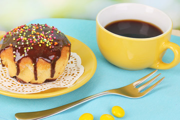 Appetizing cupcake with chocolate on nature background