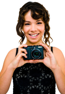 Smiling teenage girl photographing