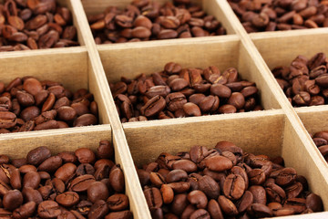 Coffee beans in wooden box close-up