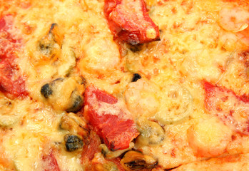 tasty pizza with shrimps and mussels close-up