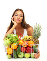 beautiful young woman with fruits and vegetables in shopping