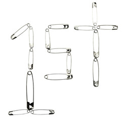 Close-up of 1st written with safety pins