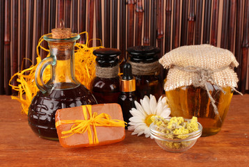 ingredients for soap making on brown background