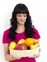 Woman holding bascet of fruits
