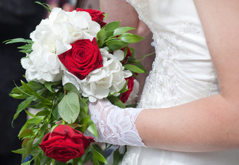 Wedding bouquet of red roses and white flowers