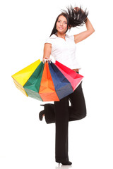 Full body portrait cheerful businesswoman holding shopping bags