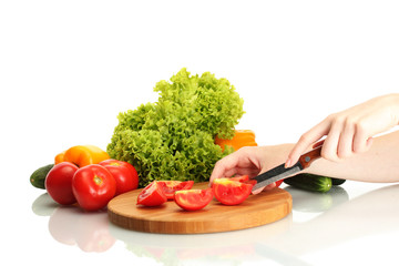 woman hands cutting vegetables on kitchen blackboard