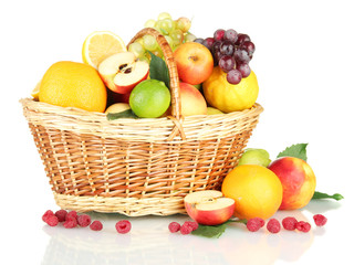 Assortment of exotic fruits in basket, isolated on white