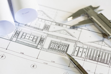 Construction plans and drawing tools on blueprints