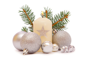 Christmas decorations and advent candle on white background.