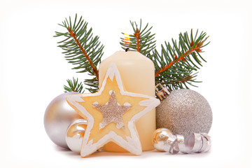 Christmas decorations and advent candle on white background.