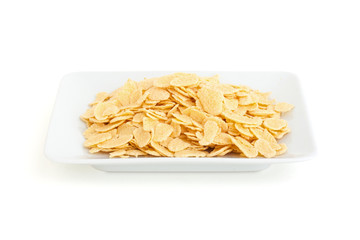 Corn flakes in a plate isolated on white background