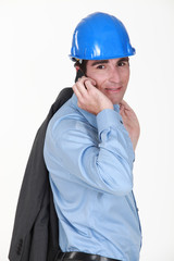 Man making call with jacket over shoulder