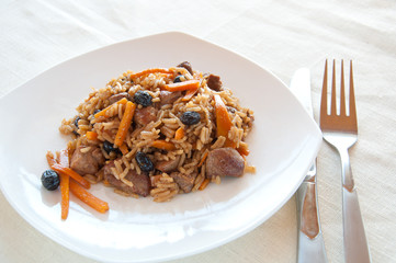 Pilaf with turkey, carrots, spices, and dried fruits