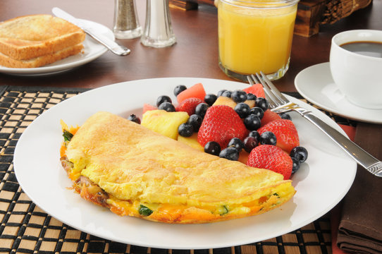 Breakfast omelet wiht fruit and berries