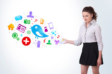 Young business woman presenting colourful social icons