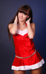 Fototapeta premium winter portrait of a santa woman with a christmas gift