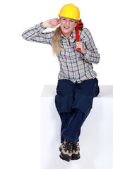 blonde craftswoman straining her ears