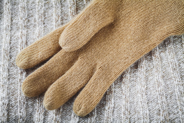 glove on wool sweater