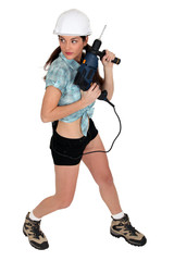 Sexy girl holding drill