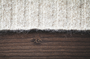 wool sweater on wood