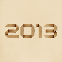 Happy new year 2013 recycled papercraft background.