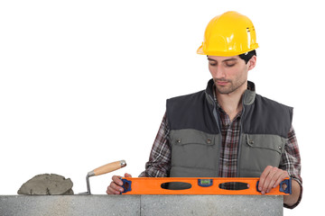 Mason with spirit level