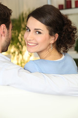 woman sitting on sofa with boyfriend