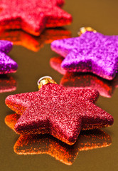colored christmas stars, supported gold background