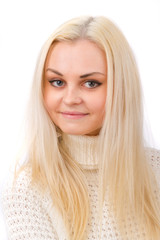 Naklejka premium Beautiful blonde in a white sweater on a white background.