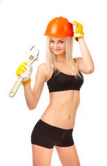 Beautiful blonde in a white sweatert, a wrench.